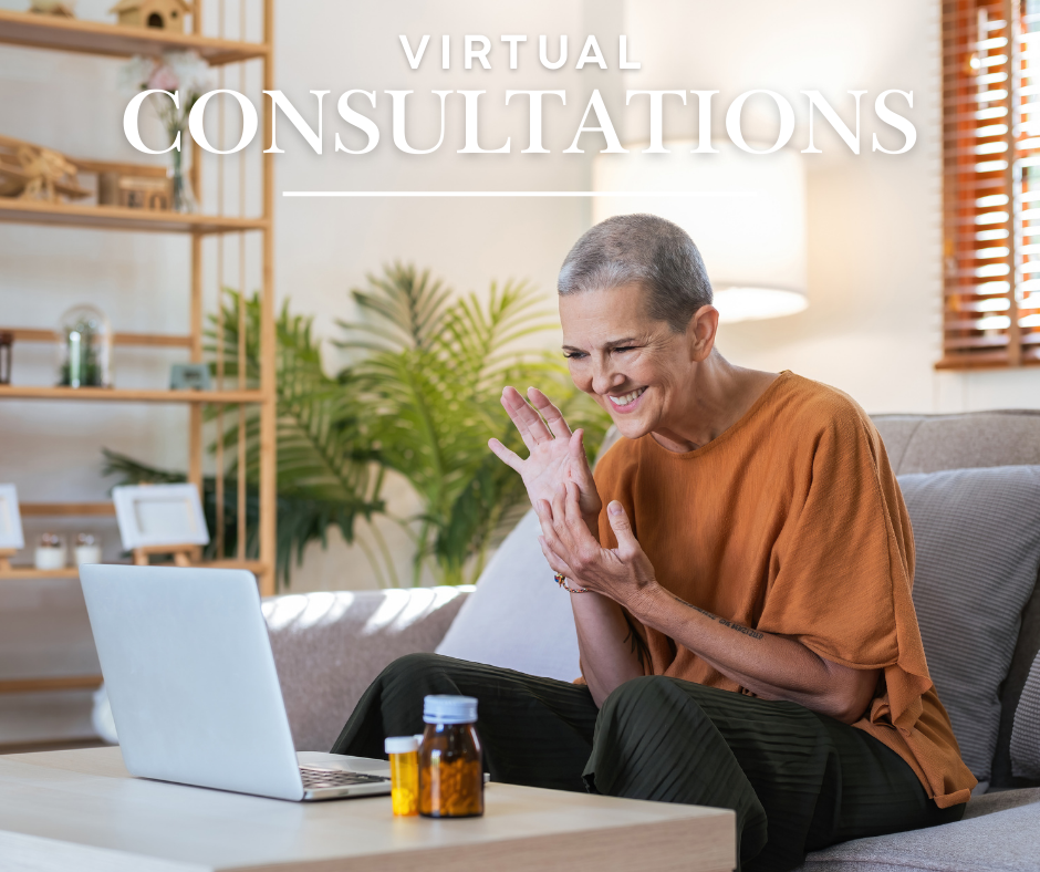 a woman having a virtual consultation on a laptop while sitting on the couch in the comfort of her own home